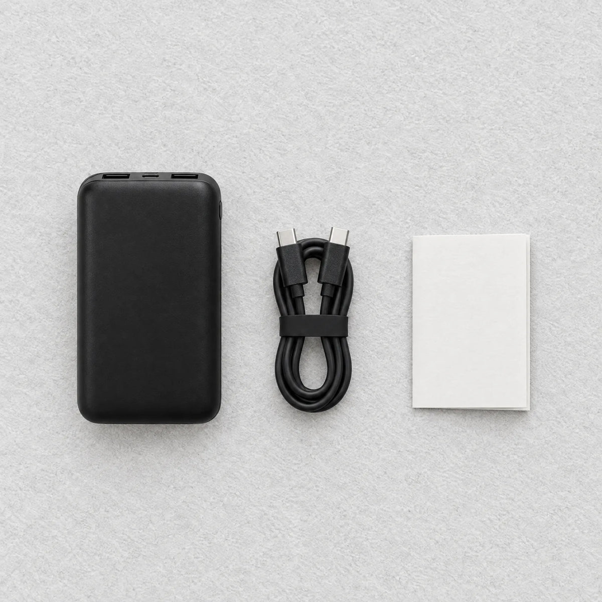 Lieferumfang: Powerbank 10.000 mAh, Ladekabel und Kurzanleitung